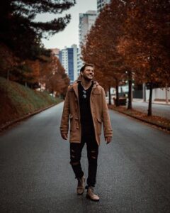 Happy guy walking down the street
