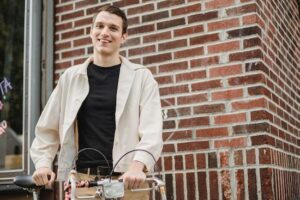 Guy smiling with a bike