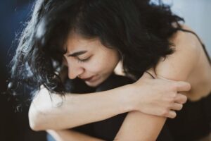 woman stressed and huddled