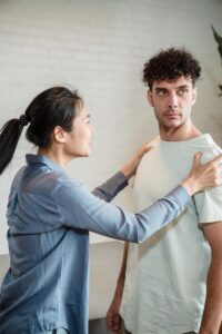 man in disbelief while woman confronts him