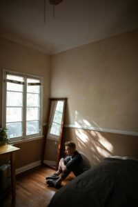 man alone in room on floor