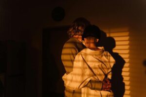 Couple hugging in the dark